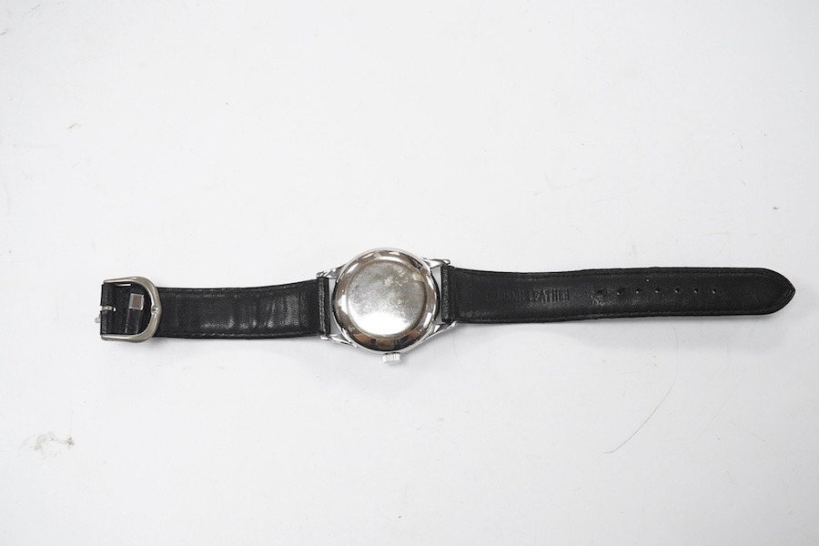 A gentleman's 1940's? steel calandar moonphase manual wind wrist watch, the dial inscribed Tiffany & Co, with Arabic dial and day/date apertures, case diameter 33mm, on a later associated leather strap, movement unsigned